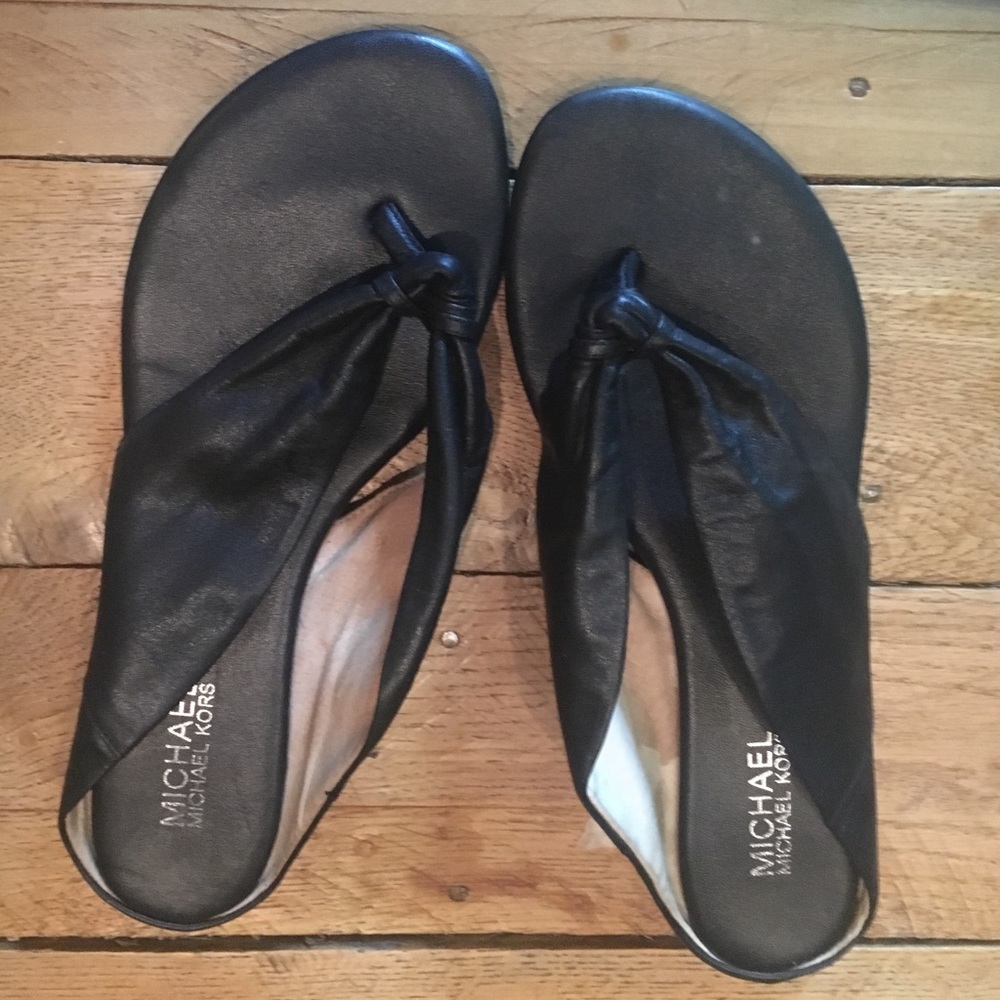 Michael Kors black leather flip flops